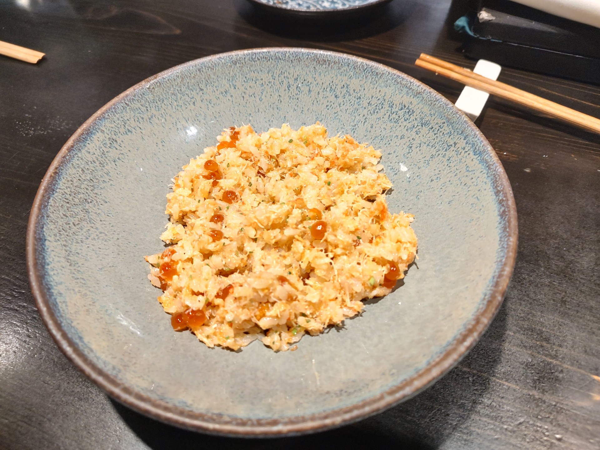 The Kani Miso, a warm snow crab dish with delightful salmon ikura. <br />(Austin Petak / The Daily Record)