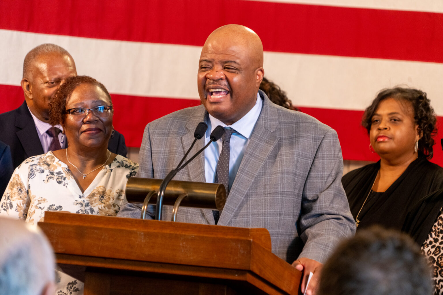 Douglas County District Judge Derek Vaughn (center) is named the next associate justice of the Nebraska Supreme Court. His wife, Jacqueline (left) and many other members of his family joined the announcement, Nov. 10, 2025.<br />(Zach Wendling / Nebraska Examiner)